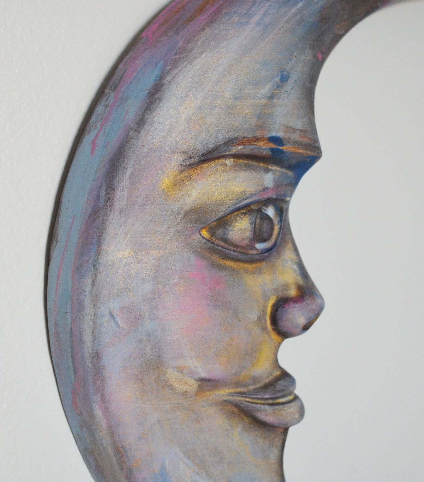 Artistic depiction of a face with a stylized, abstract design on a white background