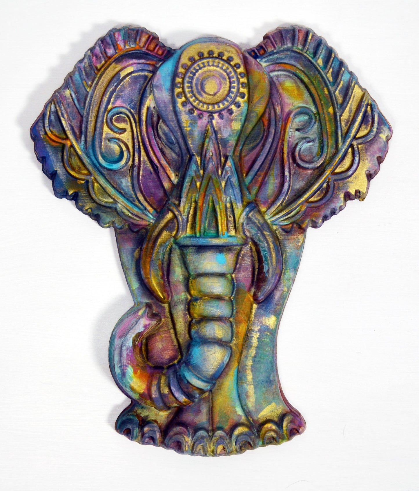 A hand-painted 3D wood carving of a colorful elephant, with intricate patterns and pastel colors, finished with a wax topcoat.