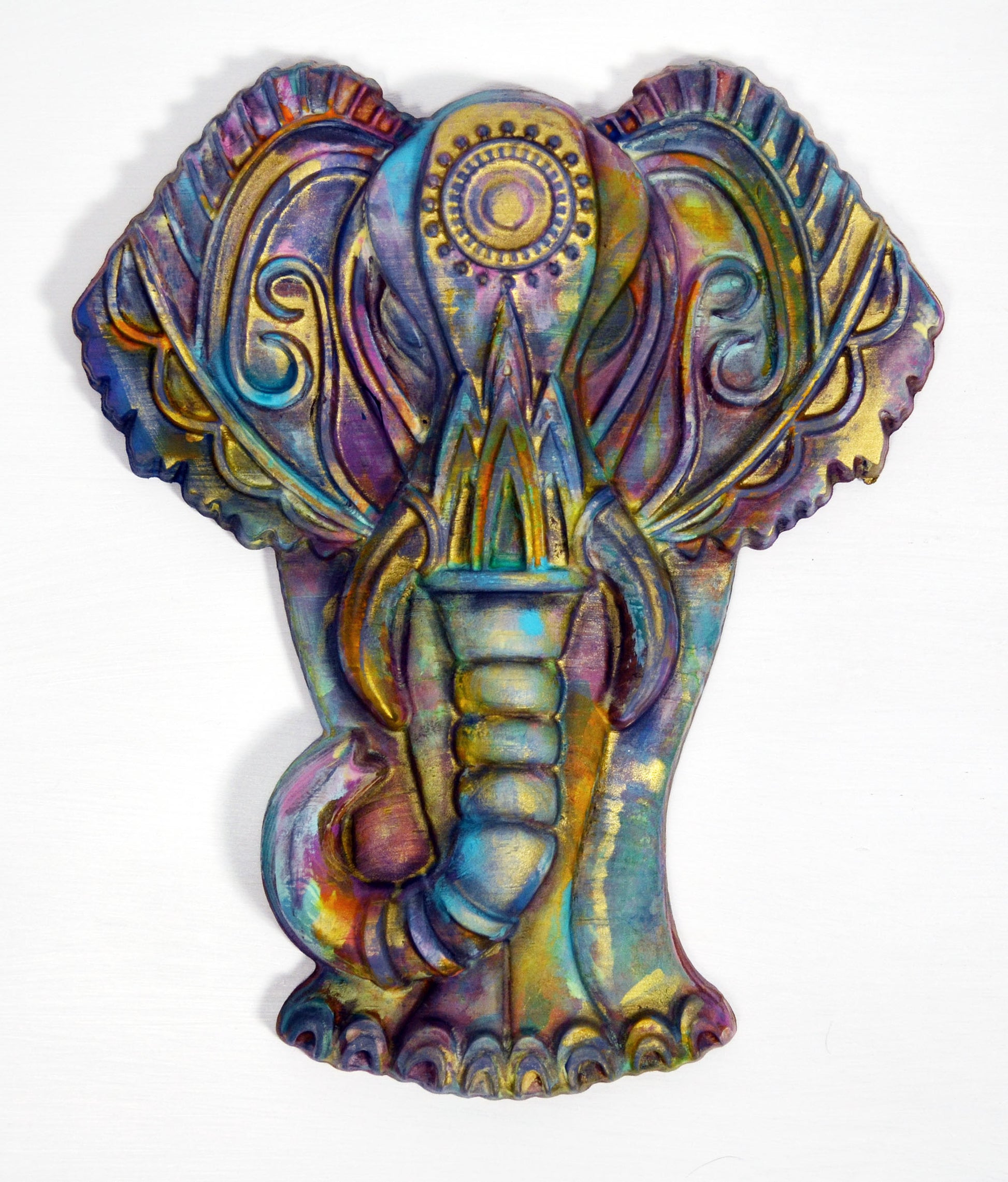 A hand-painted 3D wood carving of a colorful elephant, with intricate patterns and pastel colors, finished with a wax topcoat.