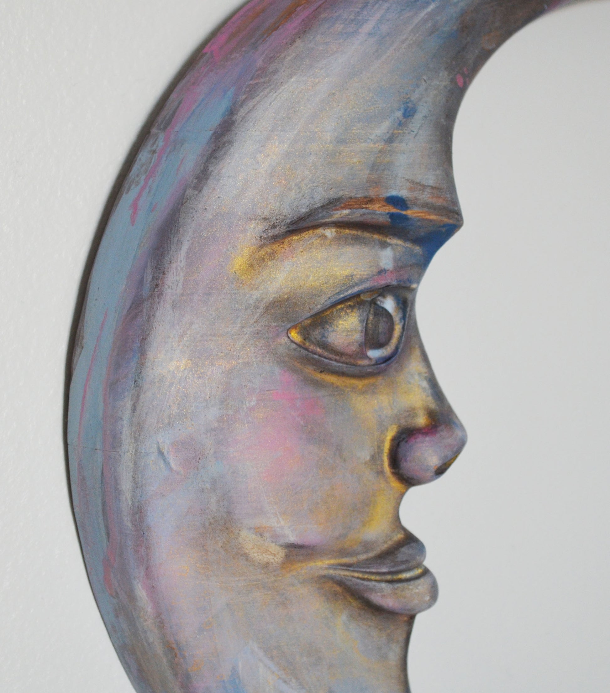 Artistic depiction of a face with a stylized, abstract design on a white background