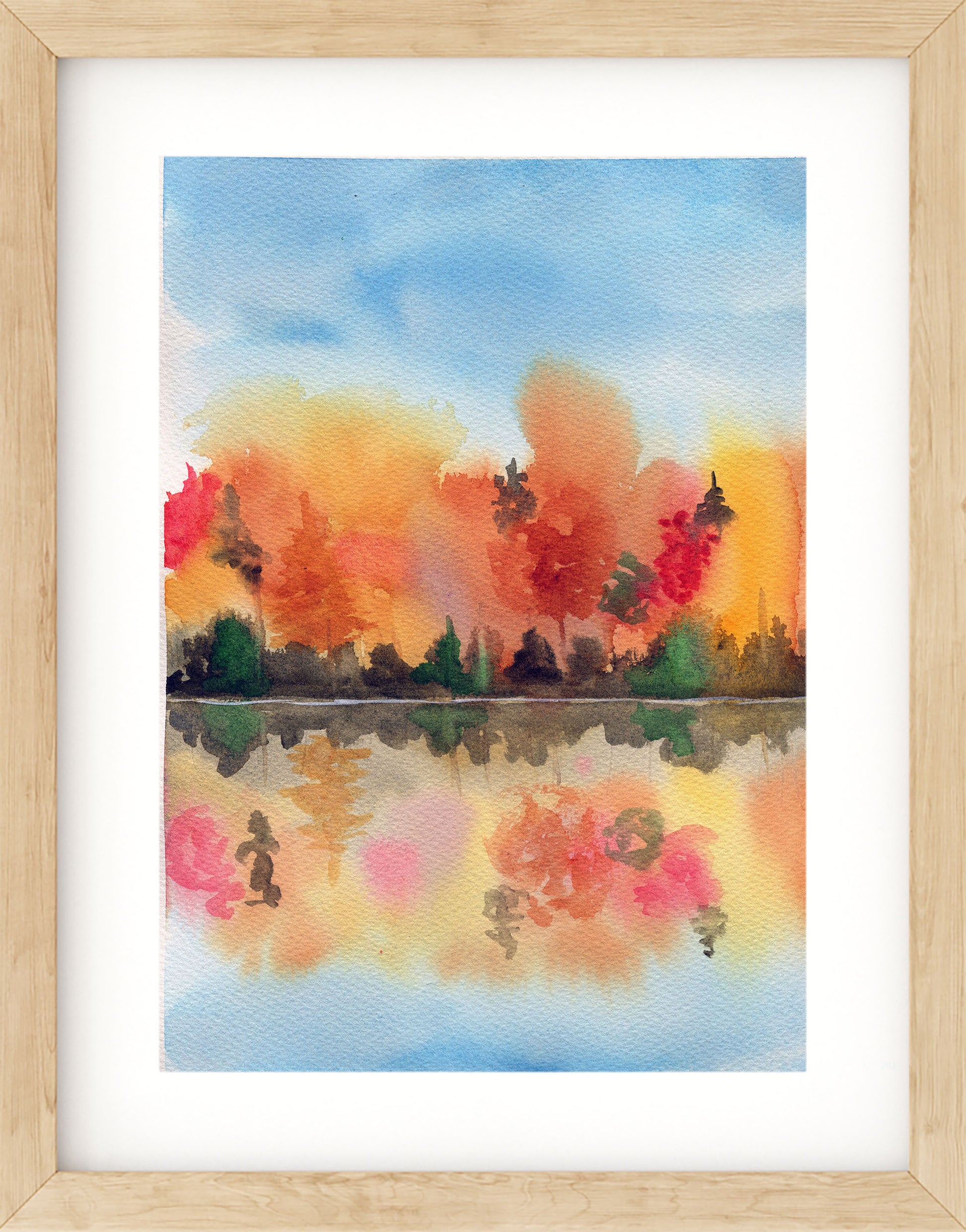 Framed watercolor painting of a colorful landscape with trees and a lake.