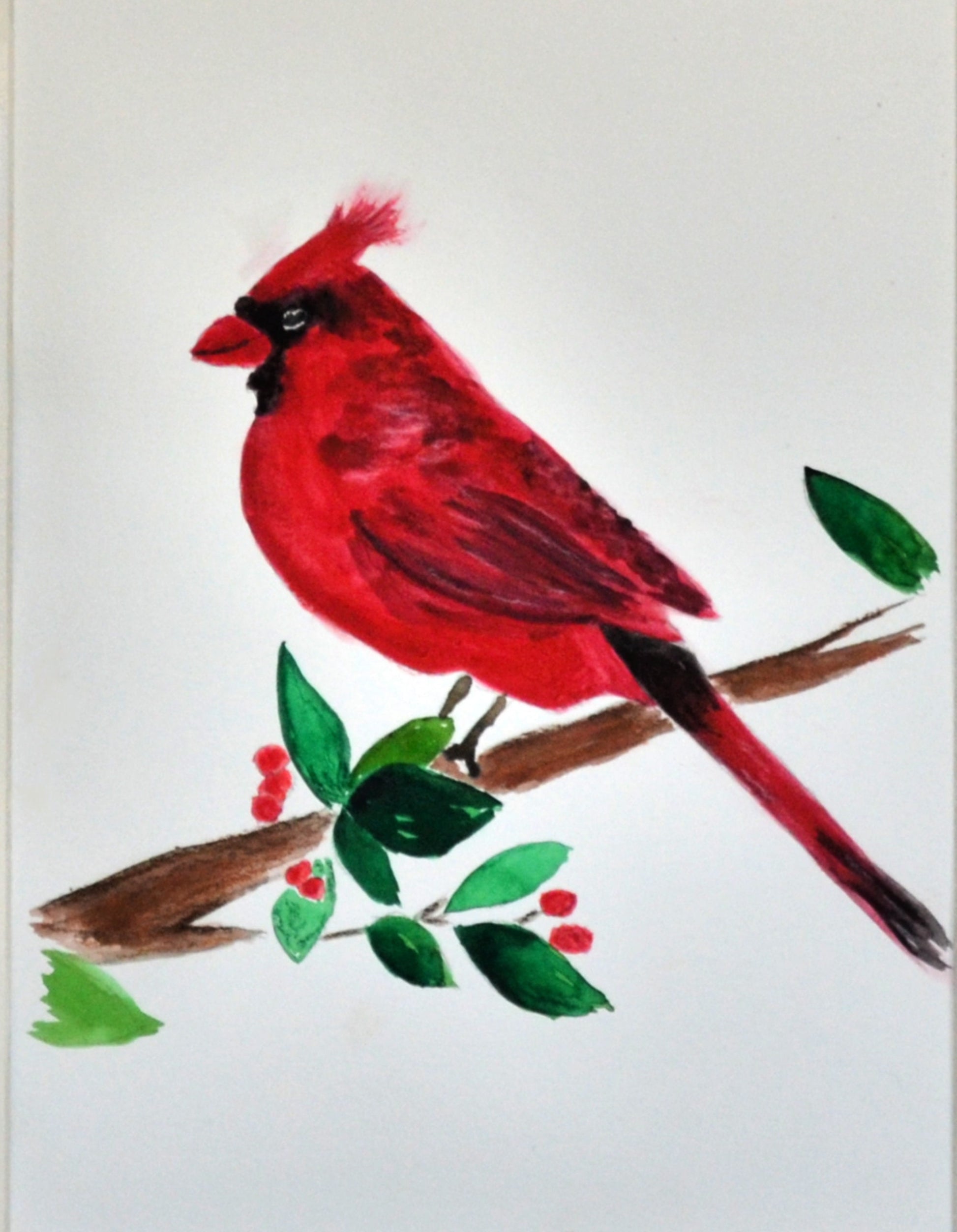 A hand-painted watercolor painting of a red cardinal bird perched on a branch with green leaves.