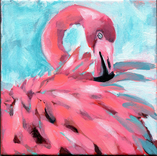 Hand painted bright pink flamingo on a blue background canvas artwork, unframed, with a blurred out background.