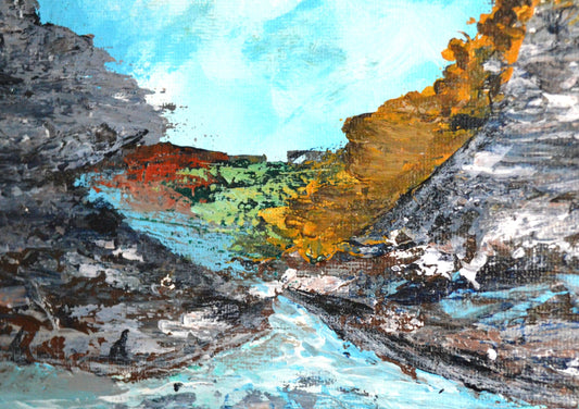 An abstract acrylic painting depicting a landscape with blue sky, orange and yellow hills, and a river, on a canvas with a textured background.