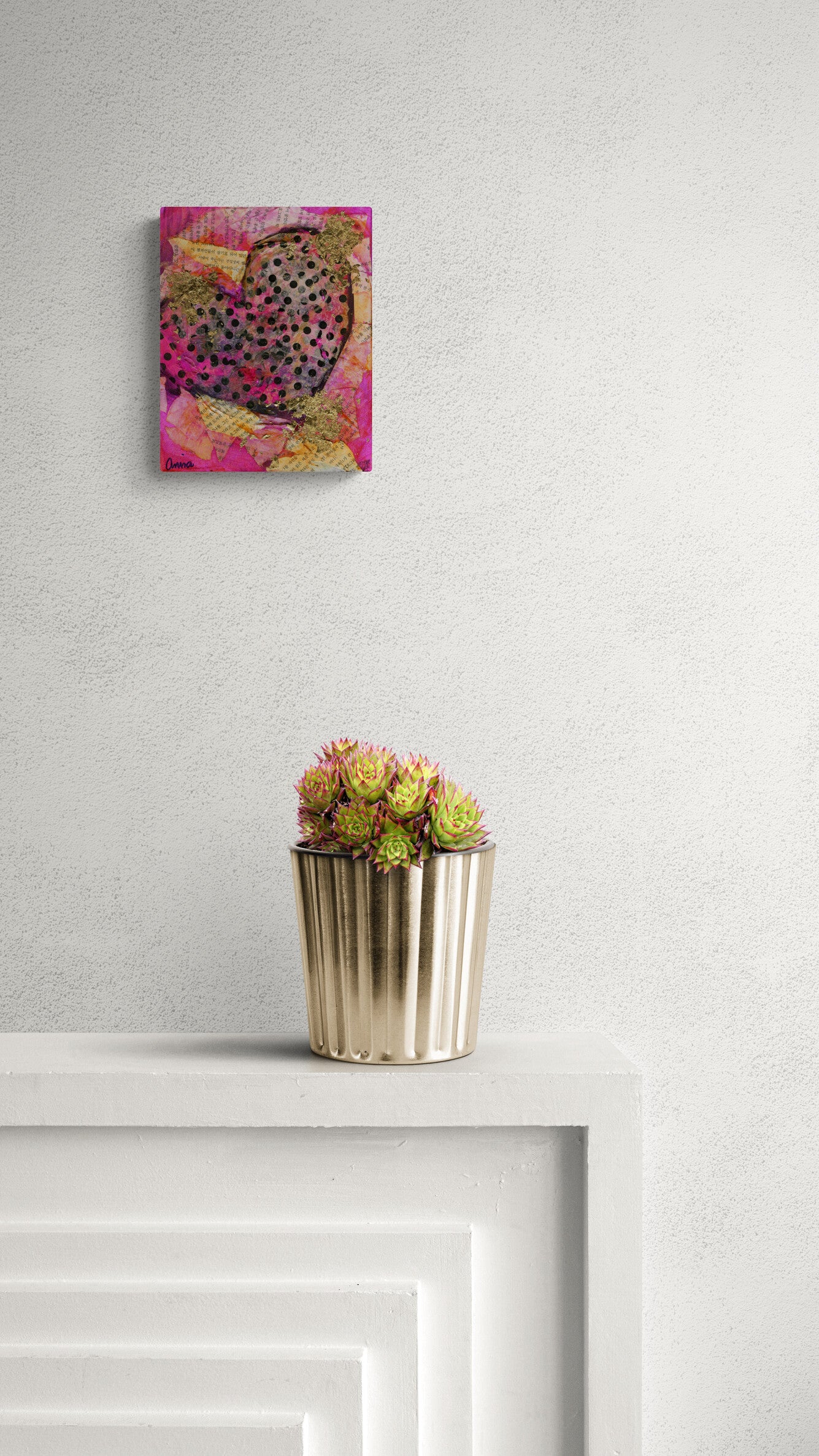 Canvas print of a colorful leopard on a wall above a metallic pot with flowers.
