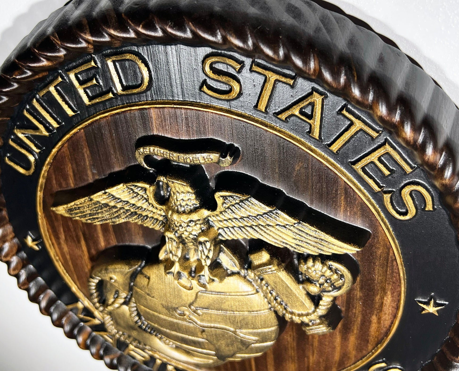 Close-up of a coin with 'United States' and an eagle emblem on a white background