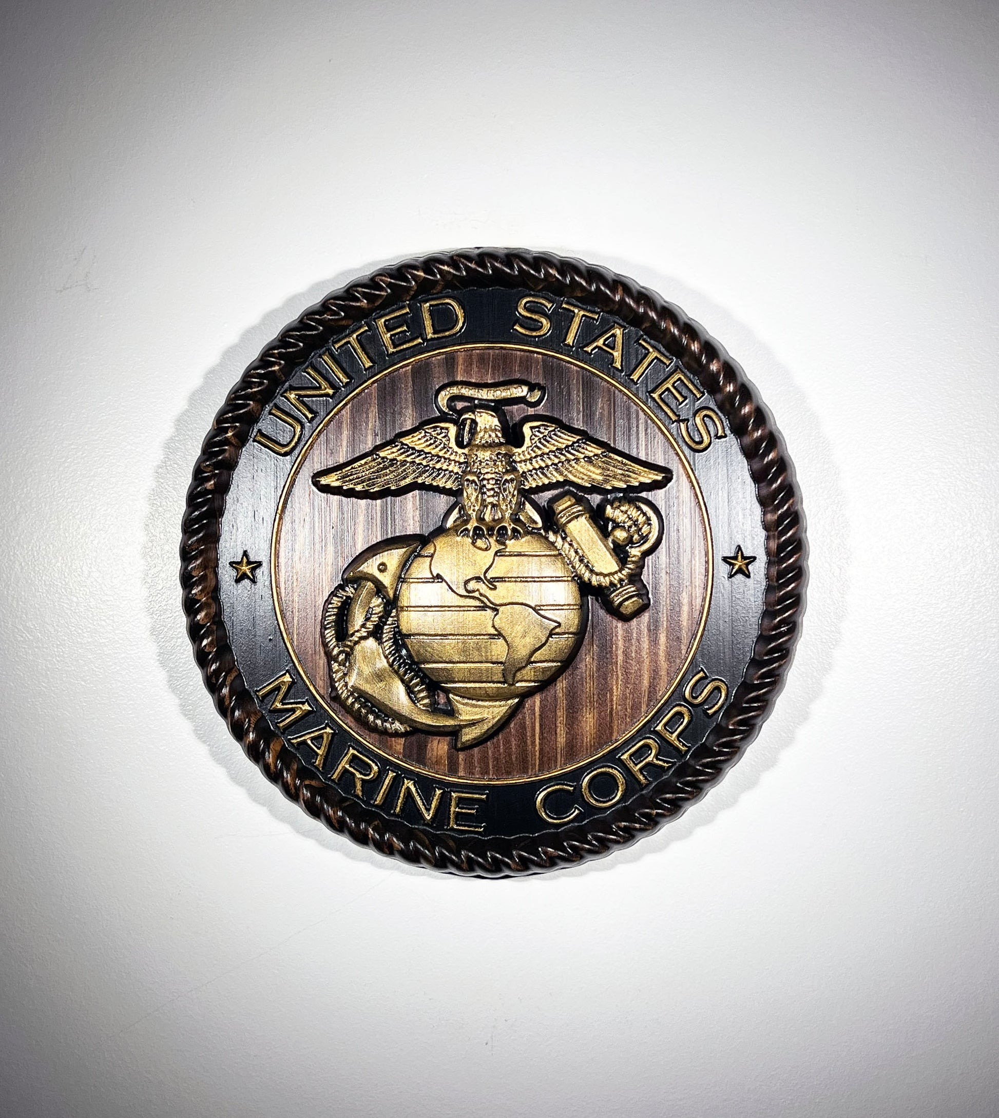 United States Marine Corps emblem on a metallic background