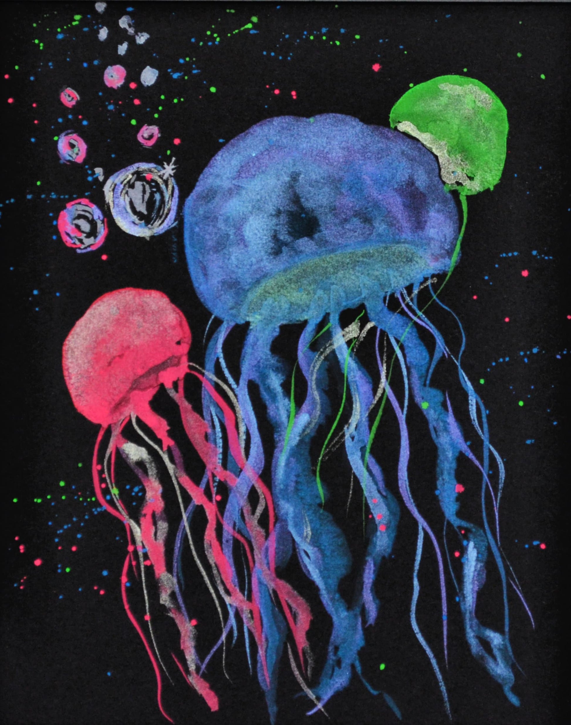 Metallic and neon watercolor jellyfish on black watercolor paper