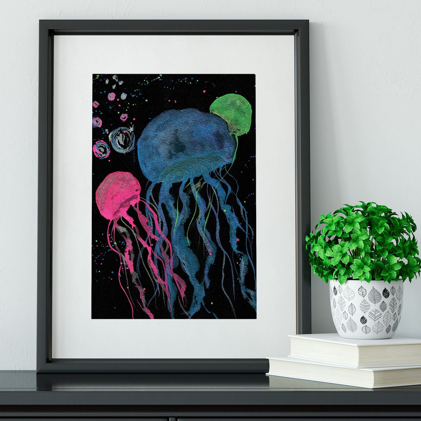 Metallic and neon watercolor jellyfish on black watercolor paper