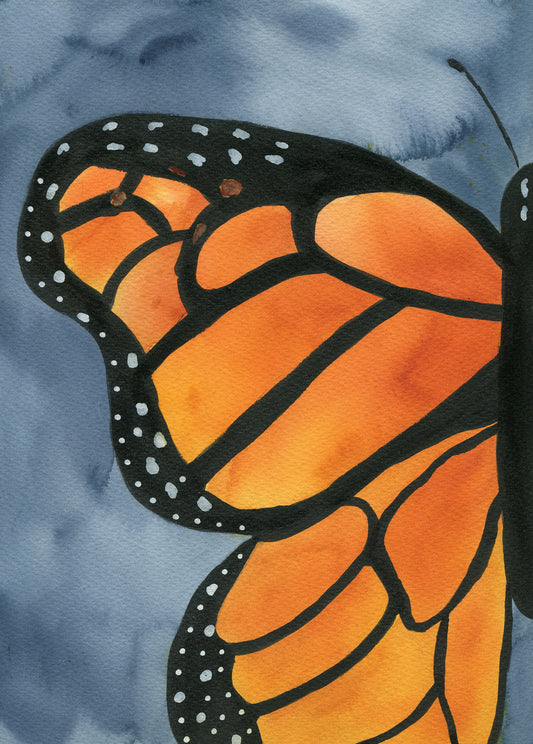 Close-up of a monarch butterfly wing with orange and black pattern on a blue watercolor background