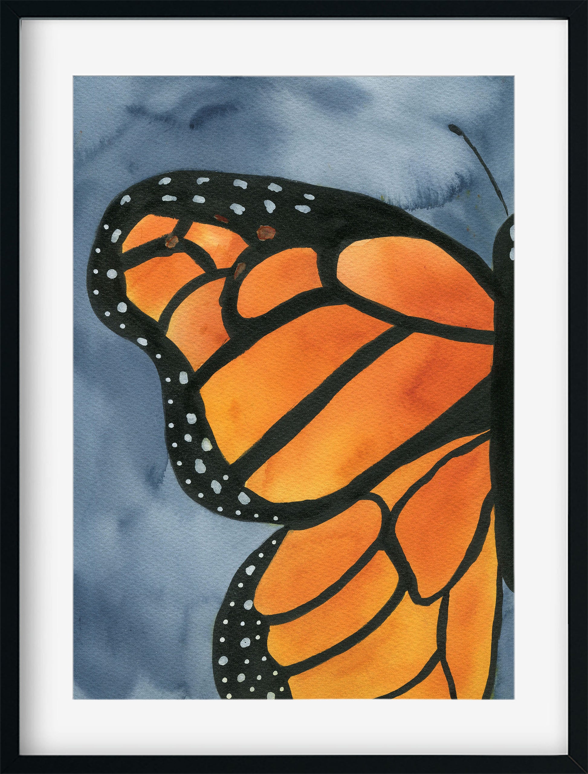 Framed artwork of a monarch butterfly wing on a blue watercolor background