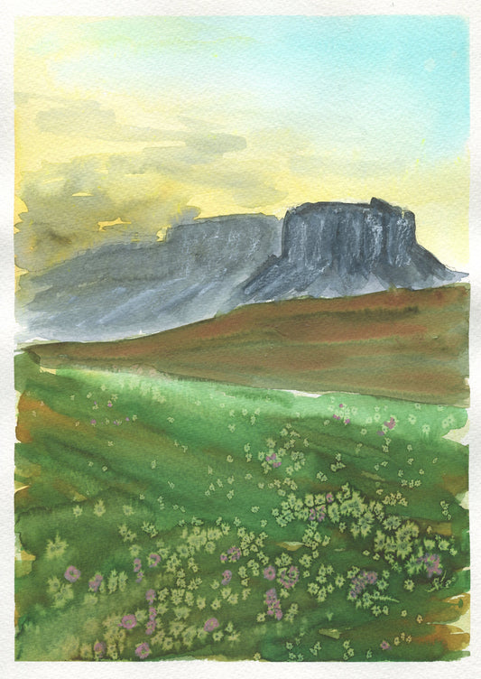 A hand-painted watercolor painting depicting a landscape with a mountain and a green field