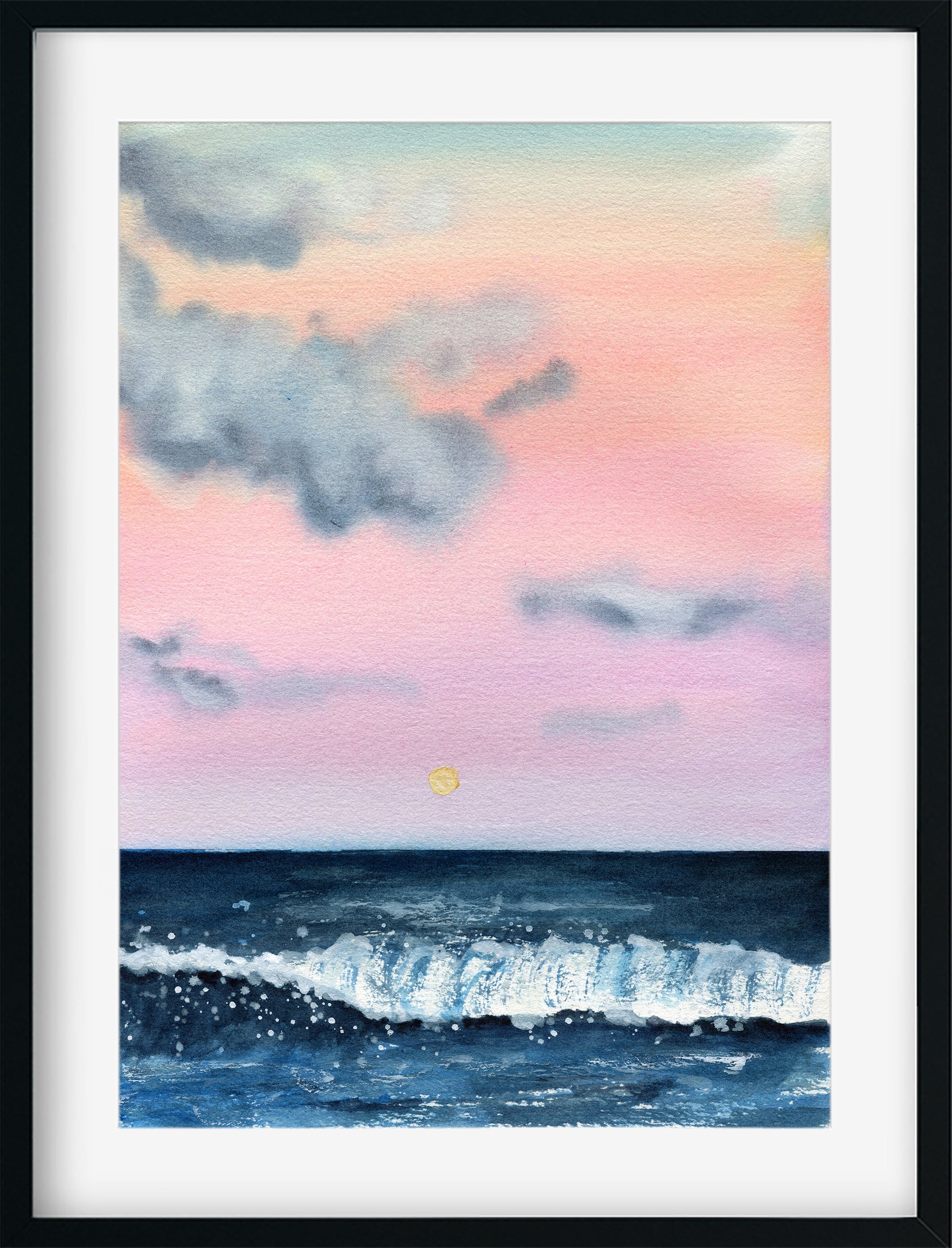 Framed artwork of a sunset over water with a colorful sky.