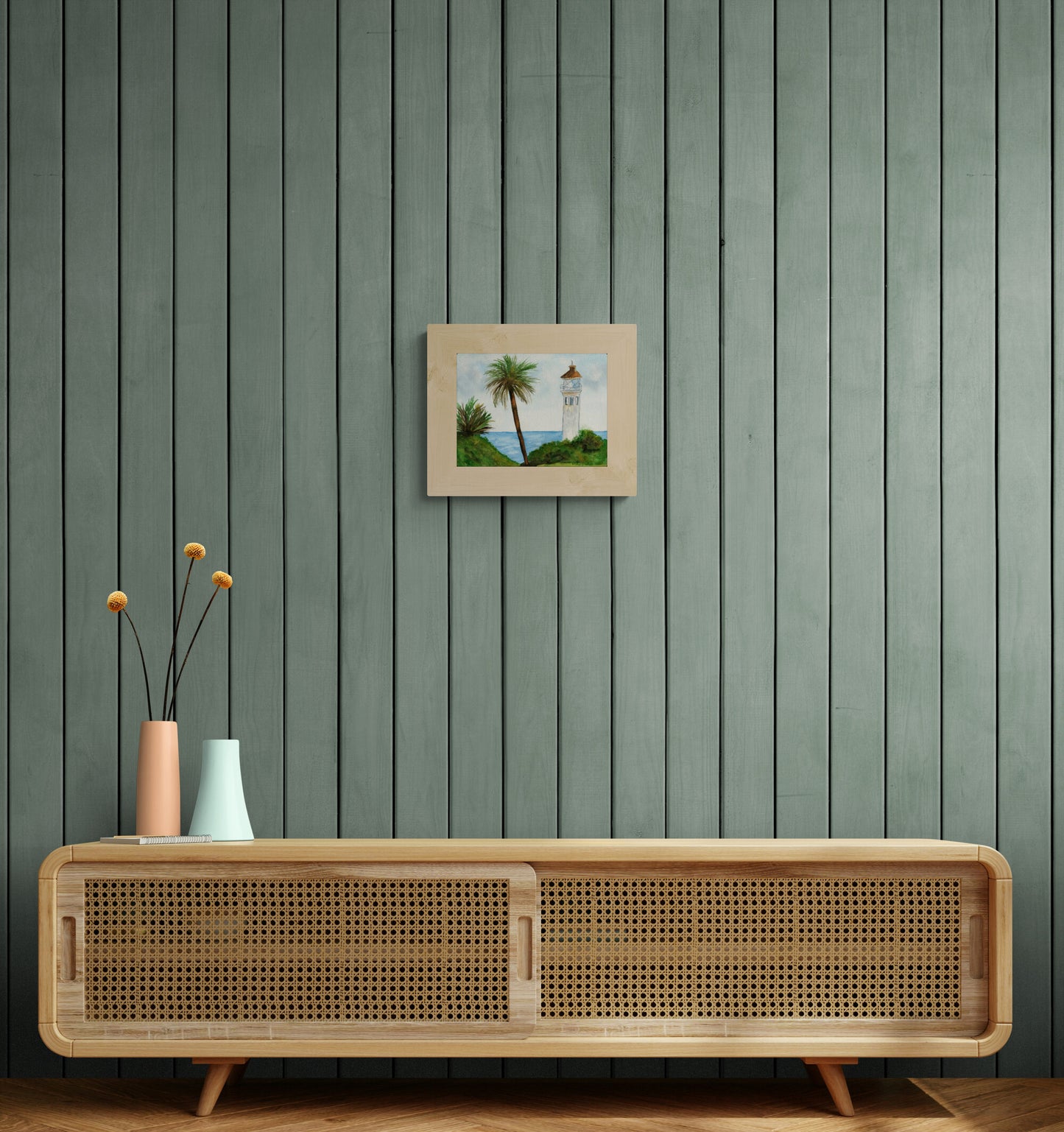 Wooden cabinet with decorative vases against a green paneled wall with a framed picture.