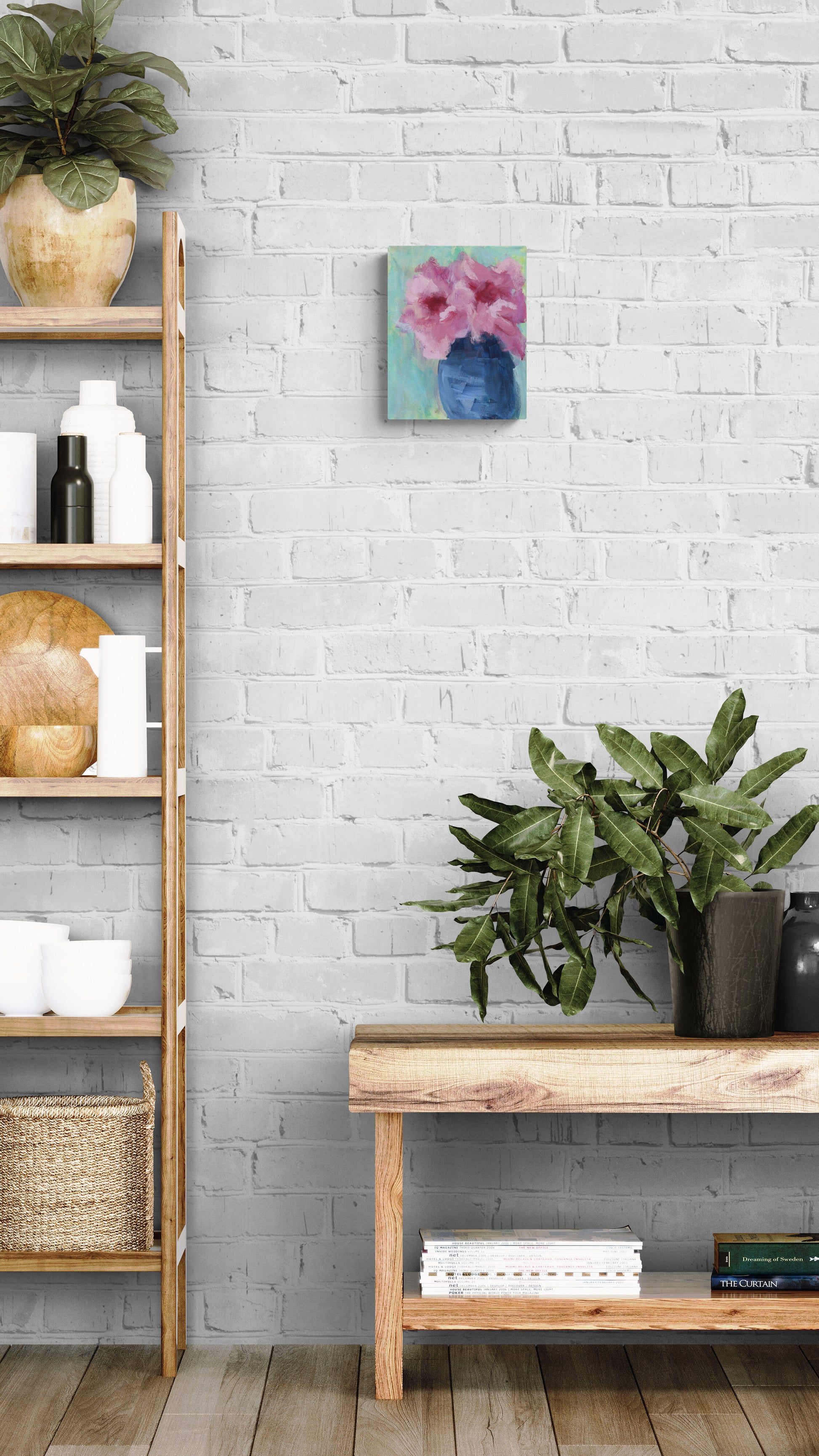 Nest living room with wooden shelf, console table, and decorative items against a white brick wall.