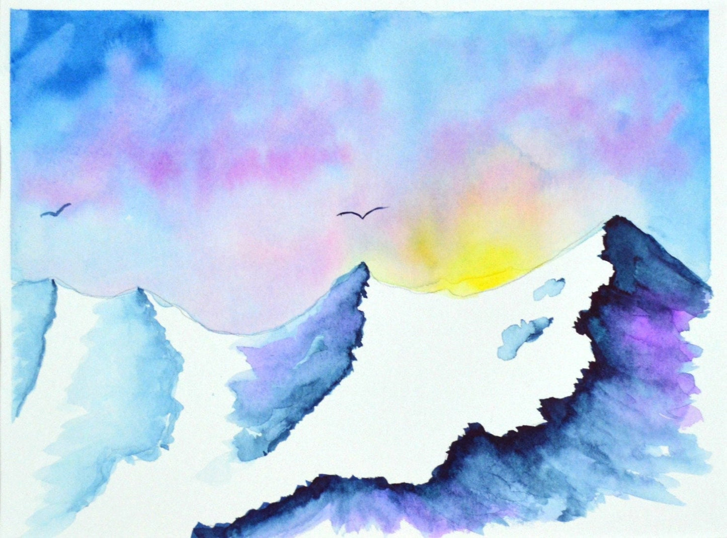 A watercolor painting depicting a snowy mountain scene with a sunrise or sunset background, featuring a flying bird and a mountain goat.