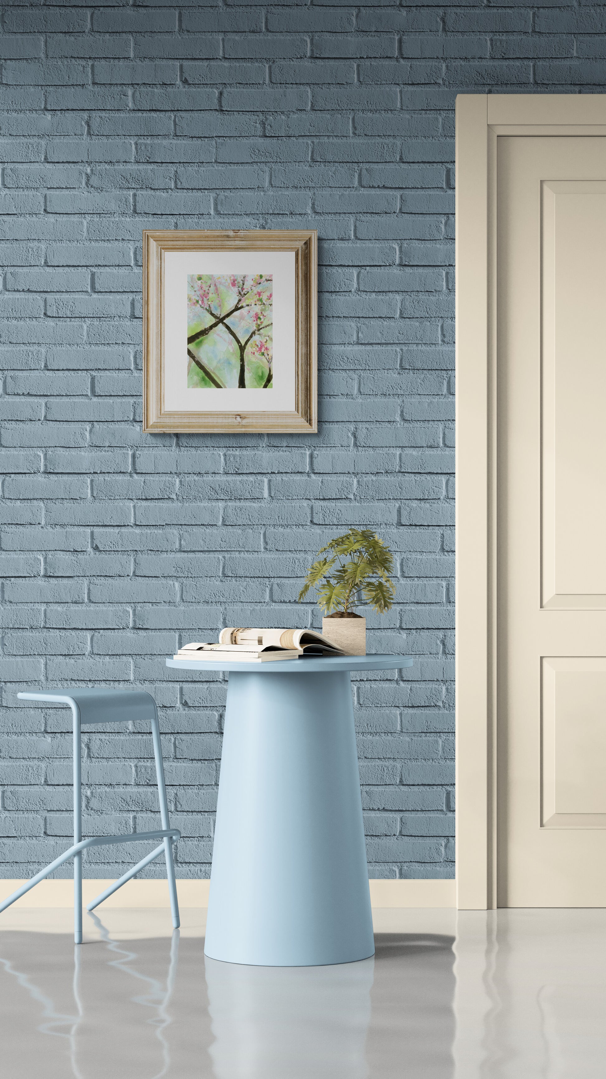 Modern interior with a blue brick wall, round table, chair, and framed artwork.