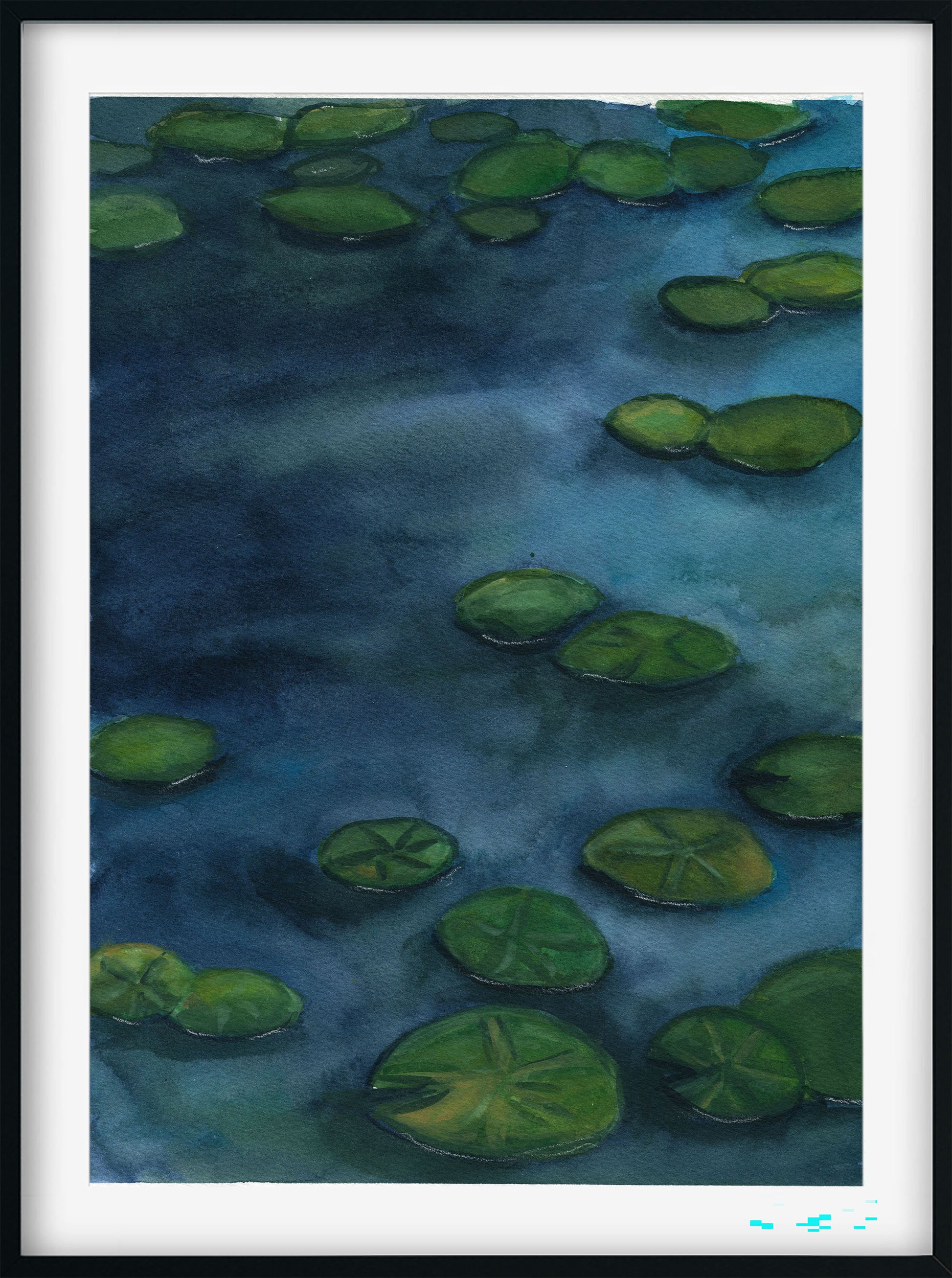 A framed watercolor painting of a pond with green lily pads floating on dark blue water, presented in a black frame with a white mat.