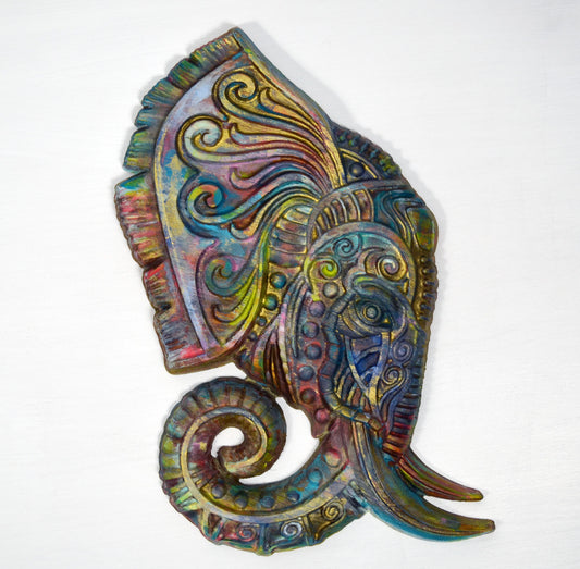 A hand-painted 3D wooden elephant carving in vibrant pastel colors with a glossy finish, distressed for a decorative look, ready to hang on a wall.