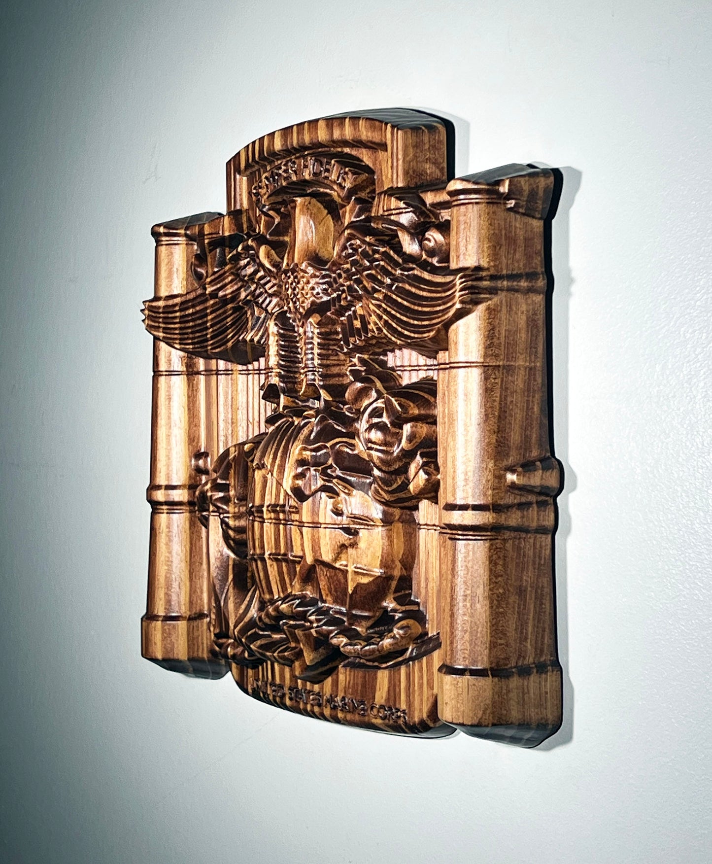 Wooden wall art with an eagle design on a gray background
