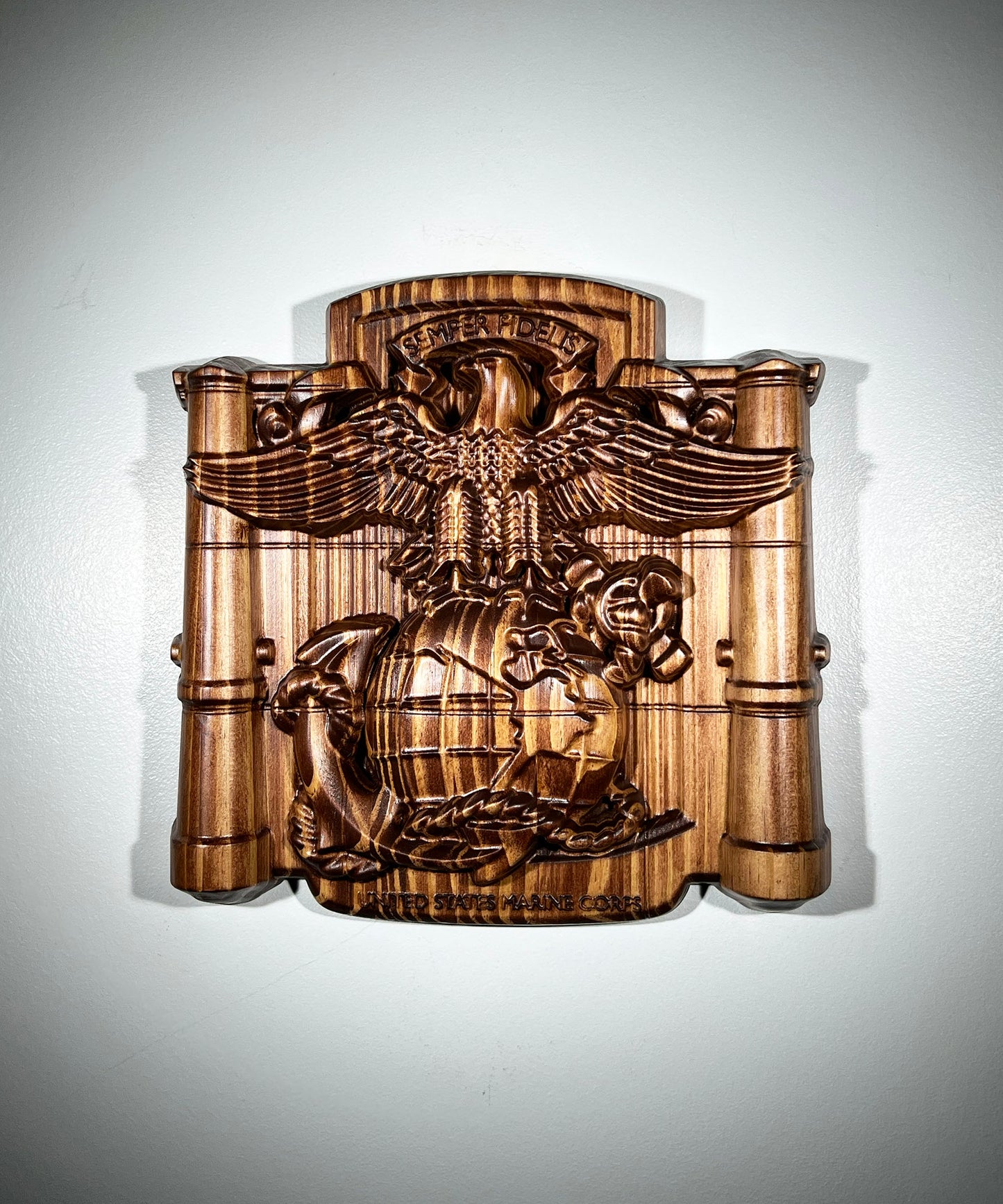 Wooden wall plaque with detailed emblem on a white background