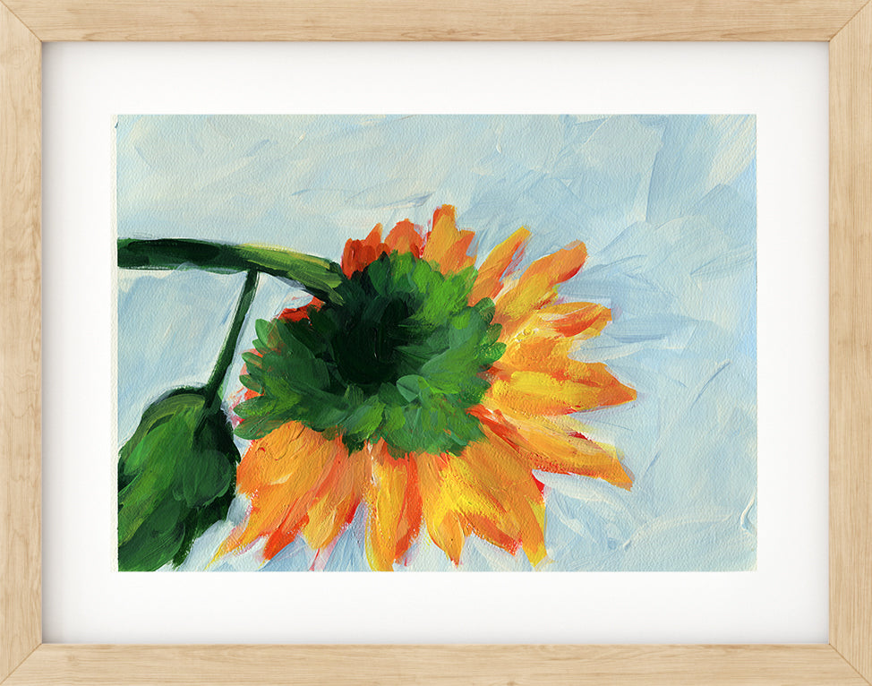 Framed painting of a sunflower with a light blue background